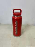 Front view of the red Hyperfly water bottle showing the branding in large silver letters.