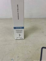 Front face of white box showing Rodan + Fields branding and product details including Redefine Triple Defense Lotion 3 AM SPF 30 30 ml.