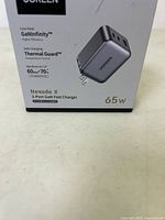 Front of the Ugreen Nexode X charger box showing product name, GaNInfinity tech, Thermal Guard, and 65W power specification.