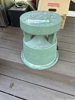 Side view of speaker showing overall shape, dirt and wear.