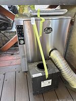 Front view of stainless steel electric smoker model BS1019 with cold smoke generator box in front