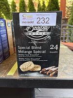 Front view of a box of Bradley Smoker Special Blend Wood Bisquettes showing quantity and design.