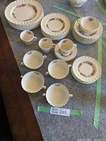 Full assortment of Rose Briar china, showing cups, saucers, and plates arranged on a table.