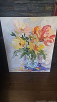 Front view of unframed canvas showing floral oil painting