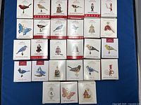 Overhead view of 24 boxed ornaments arranged in grid