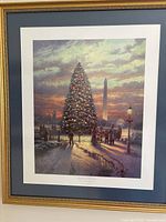 Full view of framed art print showing the Christmas tree, people, and Washington Monument at sunset.
