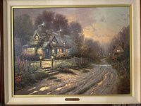 Frontal image of the framed painting showing the cottage, path, garden, and atmospheric sky at dusk.