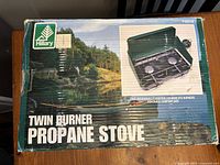 Front view of original cardboard box showing product image and brand label.