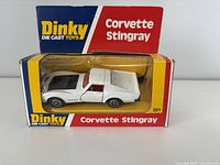 Front of box showing the white Corvette Stingray diecast model inside the original packaging with clear window.