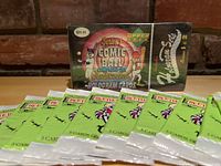 Photo showing the sealed 1992 Series 1 Upper Deck Looney Tunes Comic Ball complete set and ten unopened Beetlejuice collectible card packs laid out in front of the package.