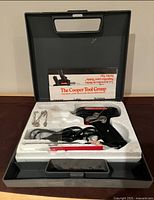 Overall view of Weller soldering kit inside case with components and manual visible.