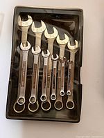 Craftsman 11-piece combination wrench set in black plastic case, some pieces missing