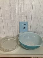 Lot 78 showing both light blue Pyrex bowl with white pattern and clear glass pie dish together.