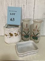 Full lot shot showing the white ceramic planter, two Bristol glass vases, and small ceramic dish against a white wooden background with a lot number card.