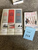 Photo showing the three hardcover volumes of The Civil War: A Narrative by Shelby Foote with their slipcase and the book Don't Know Much About the Civil War by Kenneth C. Davis alongside a lot label.
