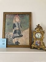 Both the framed print and the ornate gilt clock side by side showing overall appearance and scale.