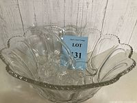 Image of the clear cut crystal punch bowl showing scalloped edges and detailed pattern.