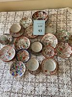 Full view of the complete collection of Japanese porcelain dishes with Geisha Girl patterned paintings