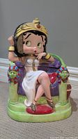 Front angle of Betty Boop cookie jar showing her seated on throne with pharaoh head details.