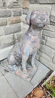 Front view of sitting dog statue on rectangular base