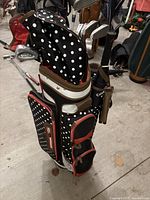 Front view of polka dot bag standing with clubs inserted