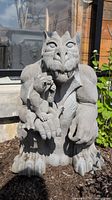 Full view of the resin gargoyle statue with the mother holding the baby gargoyle resting on her hand, showing height and overall shape.