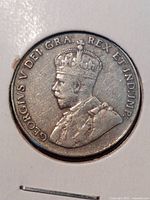 Obverse of the coin showing King George V bust, detailed with crown and inscriptions.