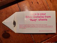 White paper envelope with pink and red text indicating receipt of Silver Dollar(s) from Fleecy Sheets promotional offer from Bristol-Myers Canada Limited.
