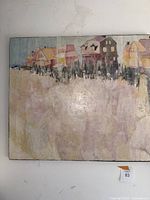 Full view of the beach themed painting showing the row of houses and beach area.