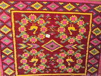 Full view of rug laid flat showing overall pattern and color scheme