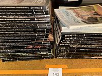 Stacked FMR magazine spines from issues #70 upward