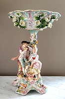 Front full view of the porcelain compote showing bowl, pedestal, base, and figural couple.