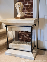 Full view of side table with bust on top