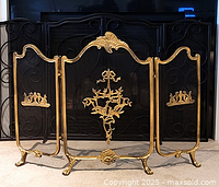 Frontal view of entire three-panel screen against fireplace