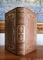 Front and back covers with gold embossed trim and filigree on brown leather