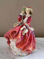 Front view of Royal Doulton porcelain figurine showing detailed painting and dress flowing