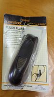 Flush plane in original packaging with printed backing card showing product name, instructions, and branding.