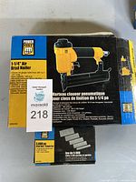 Box of Power Fist 1-1/4 inch air brad nailer specifying nail sizes, operating pressure, and compatible nail brands.