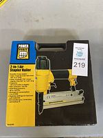 Original packaging of Power Fist 2-in-1 Air Stapler Nailer showing full front of box, highlighting the image of the tool and product name.