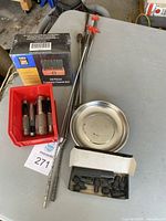 Overview of the lot showing the punches, grabbers, magnetic parts tray, box of Power Fist punches, and additional punch sockets.