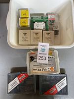 Top view of all assorted screws and boxes/containers showing the brand and type information.