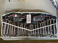 Full view of the 22-piece Power Fist combination wrench set in black fabric holder with labeled sizes.