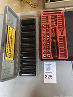 Overall view of the screwdriver bit set and the deep socket set side by side.