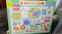 Children's zoo-themed wall poster with colorful animal illustrations and text