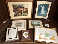 Photo showing the group of eight small framed artworks with various subjects including animals, landscapes, florals, and decorative art.