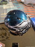 Philadelphia Eagles mini football helmet with signature on side