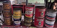 Group view of all 12 tobacco tins showing brands, colours and lid presence