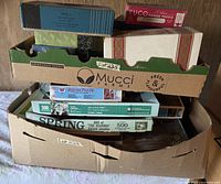 Produce box filled with multiple boxed puzzles