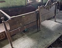 Both wooden headboards leaning against floor