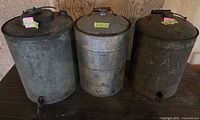 Front view of all three metal gas cans